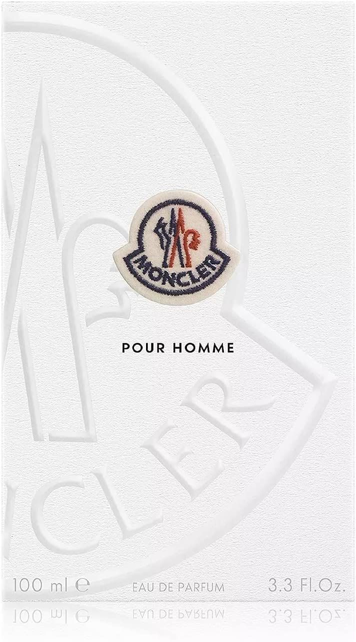 Emballage blanc avec logo Moncler et texte "POUR HOMME". Logo et texte en relief. 100 ml. Eau de Parfum.