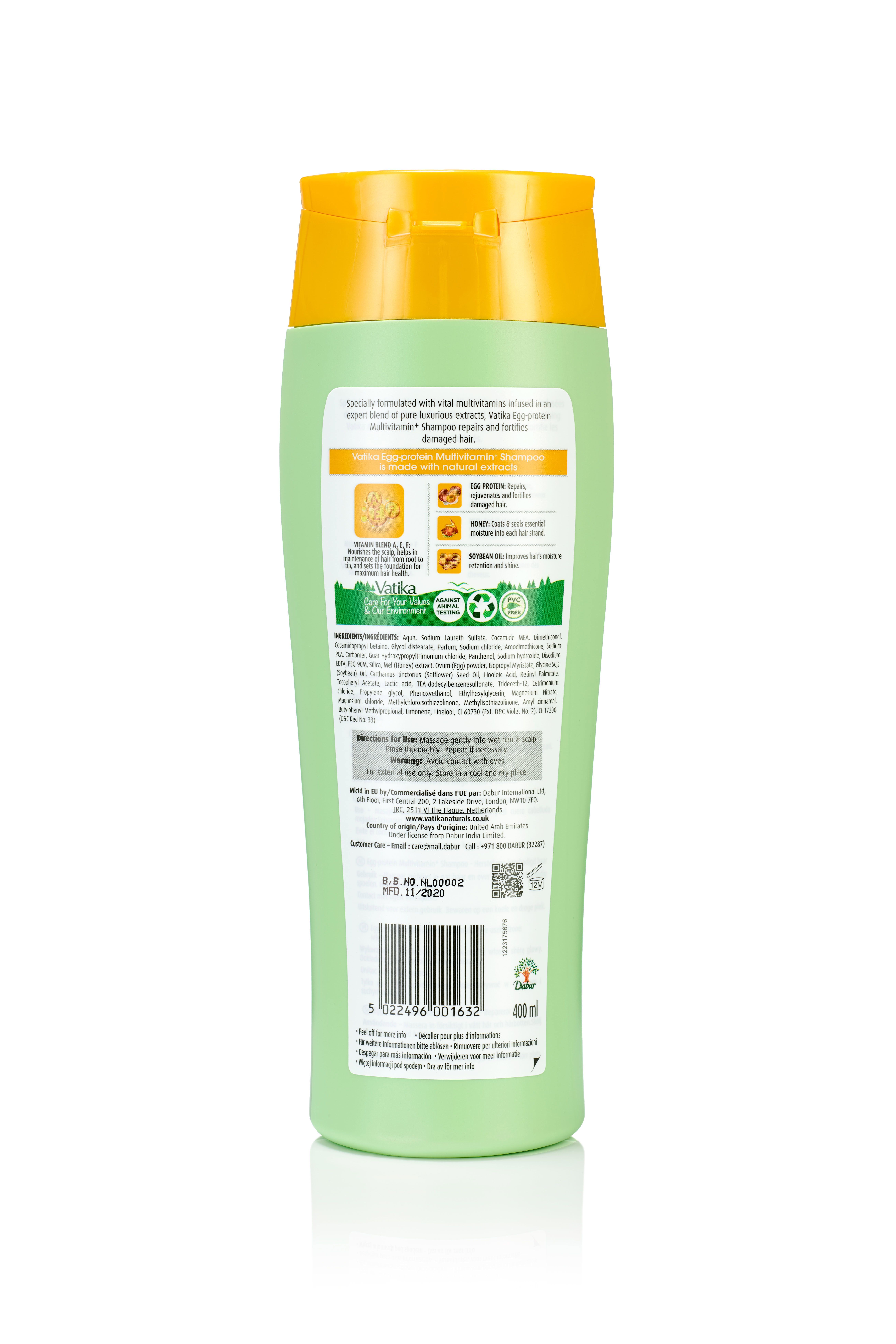 Dos d'un flacon de shampooing vert avec bouchon jaune. Texte et symboles. 400 ml.