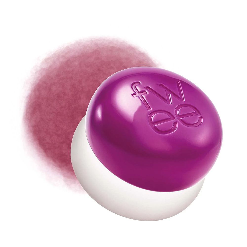 Een ronde, paarse pot met een witte basis, met het 'fwee'-logo. Daarnaast een vervaagde kleurvlek.