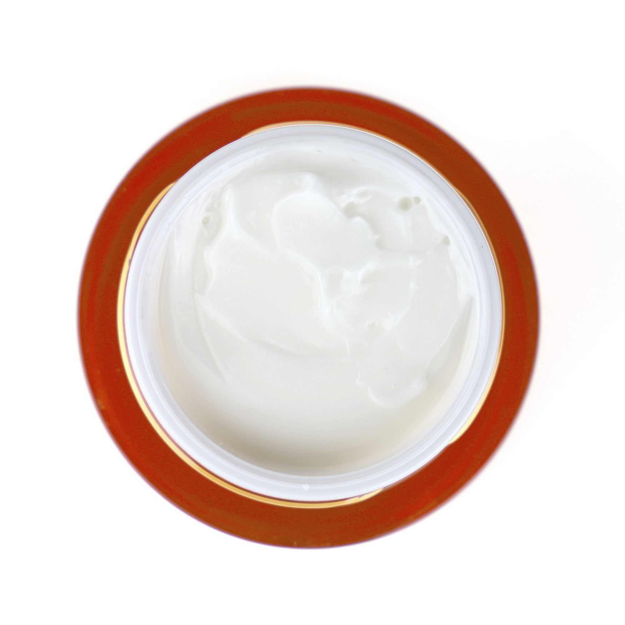 Vue de dessus d'un pot de crème ouvert. Crème visible. Inscription : PostQuam, Re-Nergie C.