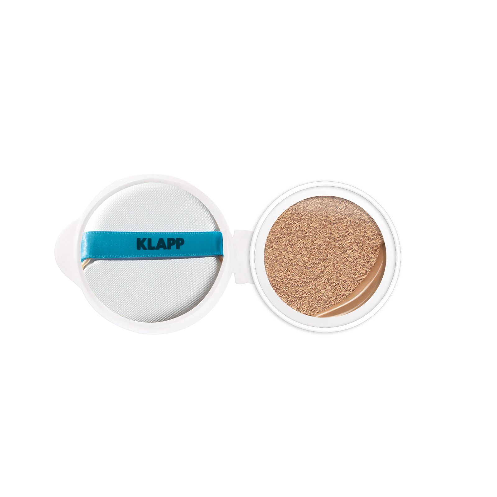 Open wit cosmetica-etui met spons en getint product. Band met "KLAPP" erop.