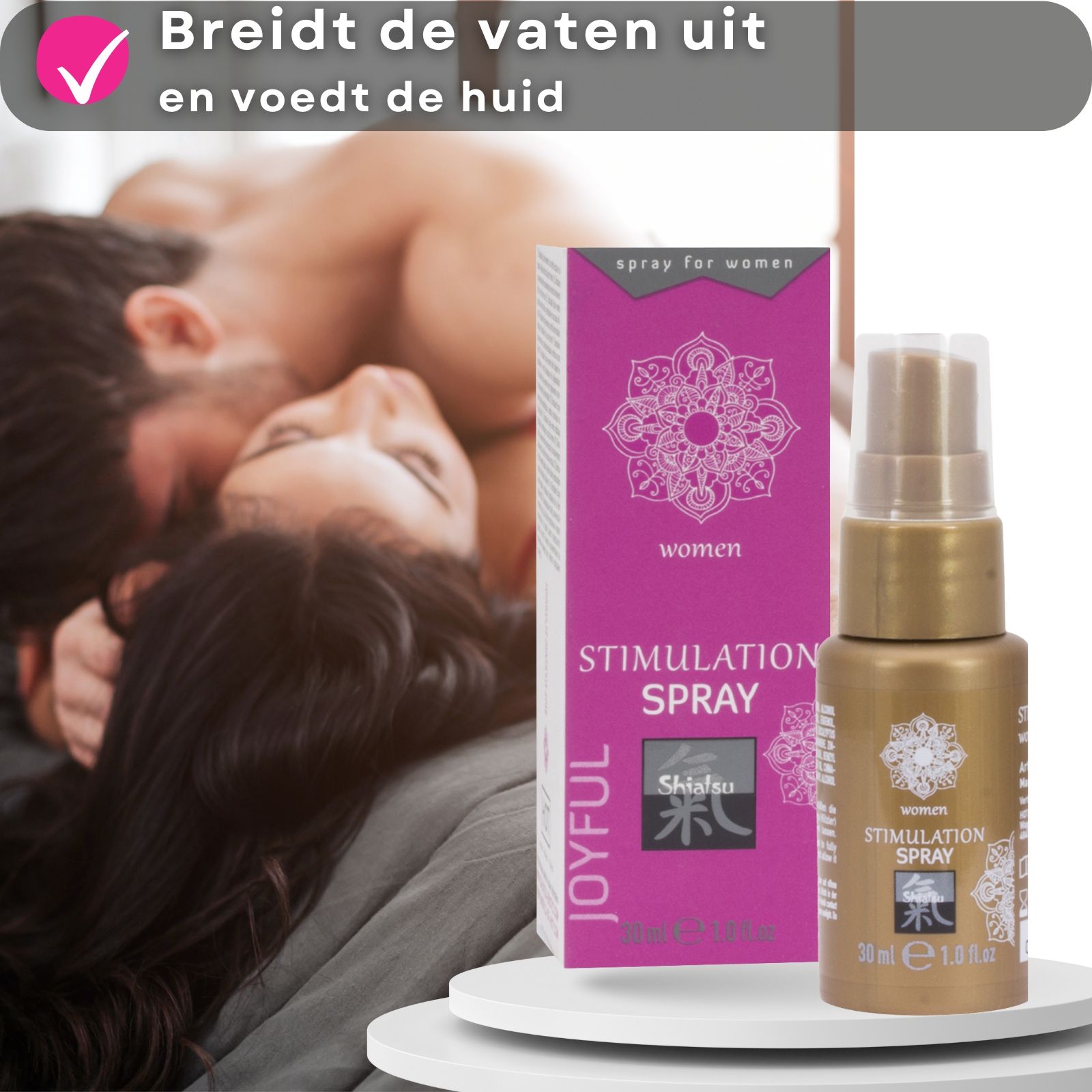 Gouden fles en verpakking. Tekst: Stimulation Spray, Shiatsu. Paar op de achtergrond.