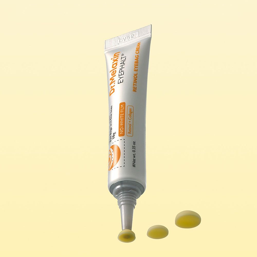 Tube de crème contour des yeux Dr. Melaxin Retinol avec applicateur et échantillons.