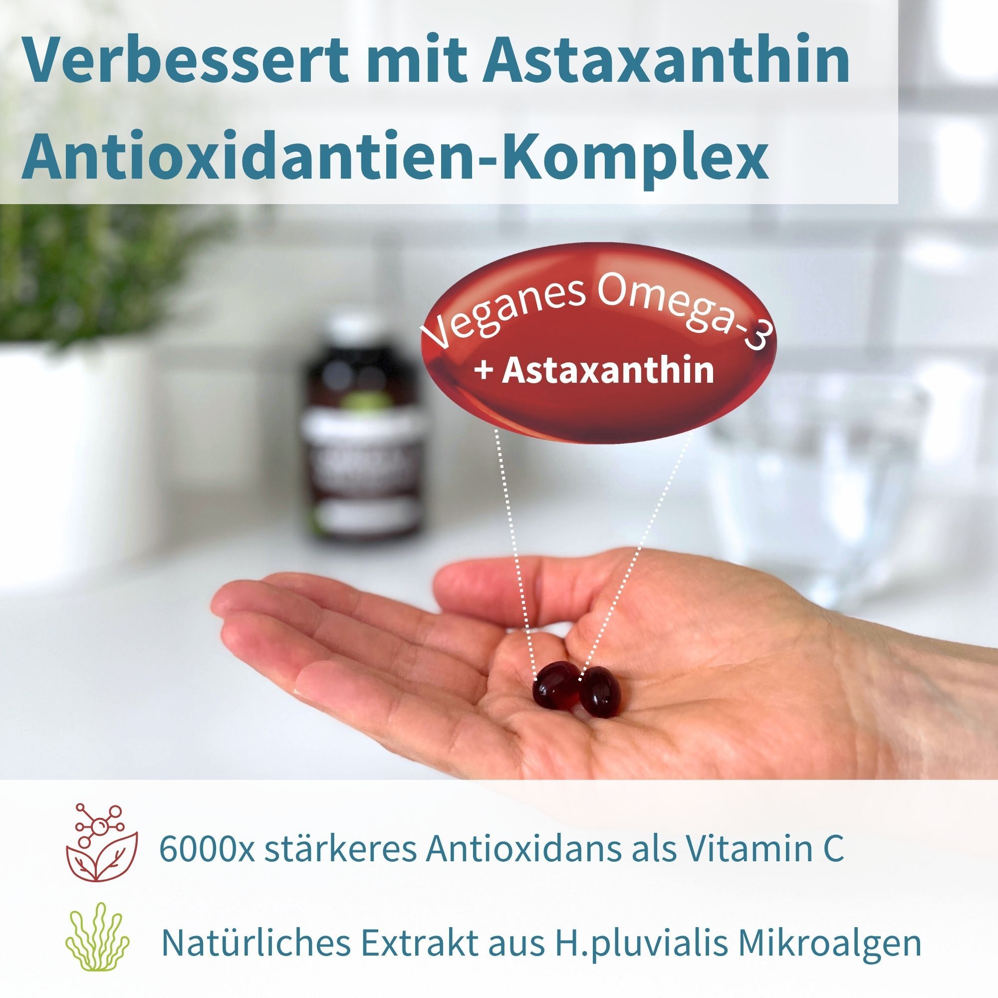 Main tenant deux gélules molles rouges d'oméga-3 végétalien et d'astaxanthine, effet antioxydant.