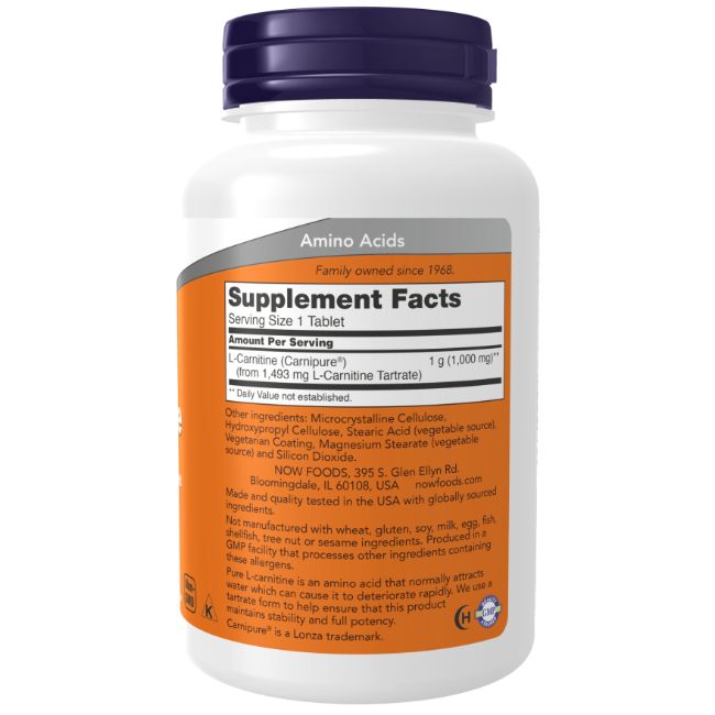Flacon blanc, bouchon bleu. Étiquette avec informations nutritionnelles et ingrédients. Texte: L-Carnitine, 1 g.