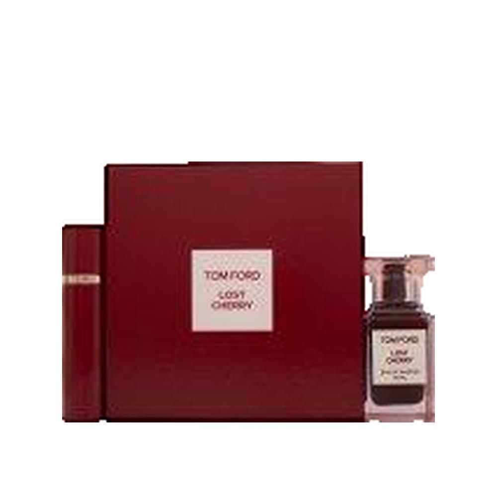 Ensemble rouge foncé avec flacon de parfum, vaporisateur et boîte. "TOM FORD LOST CHERRY" sur la boîte.