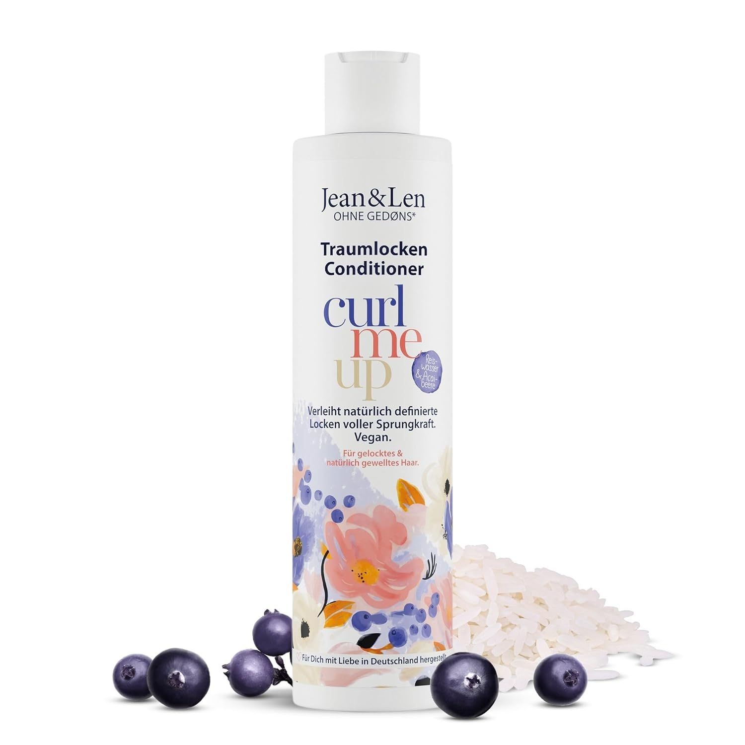 Bouteille de revitalisant Jean & Len Traumlocken. Baies et riz devant la bouteille.