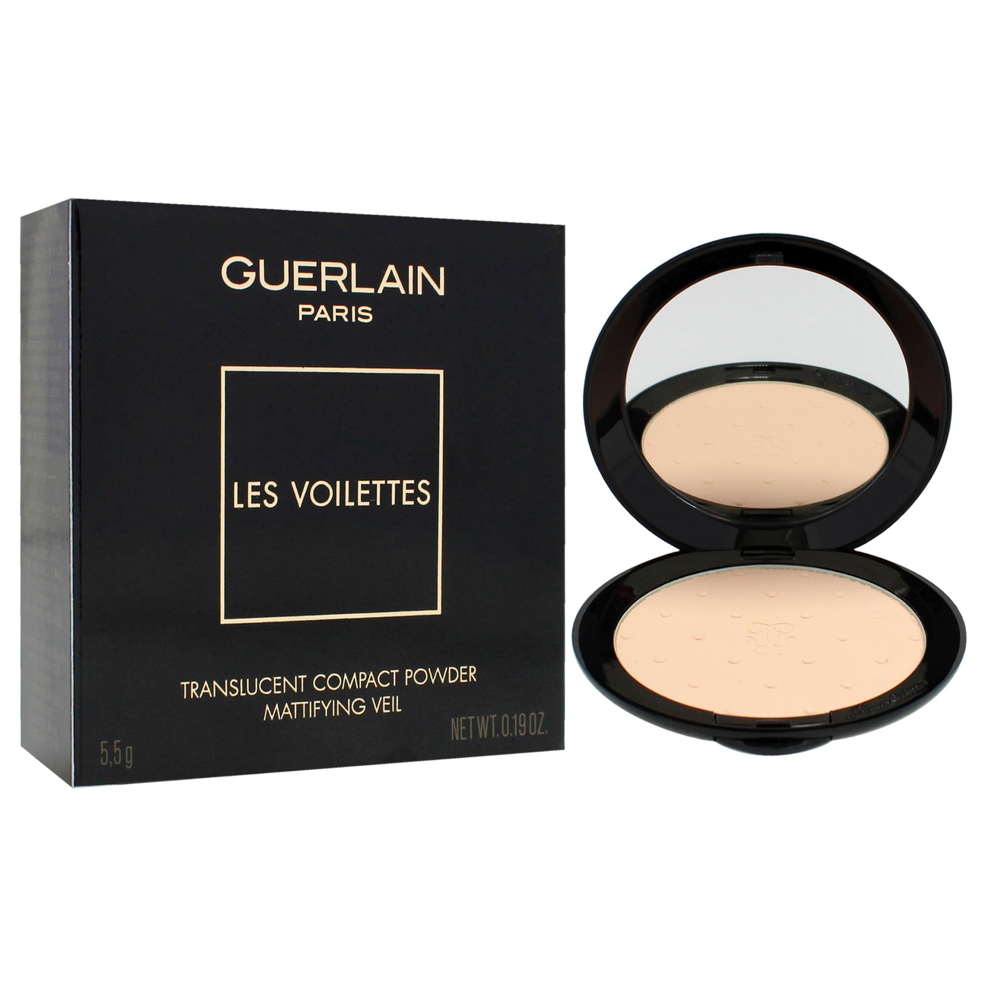 Poudre compacte avec miroir. Boîtier noir ouvert. Poudre beige clair. Texte: Guerlain, Les Voilettes, Translucent Compact Powder, Mattifying Veil.