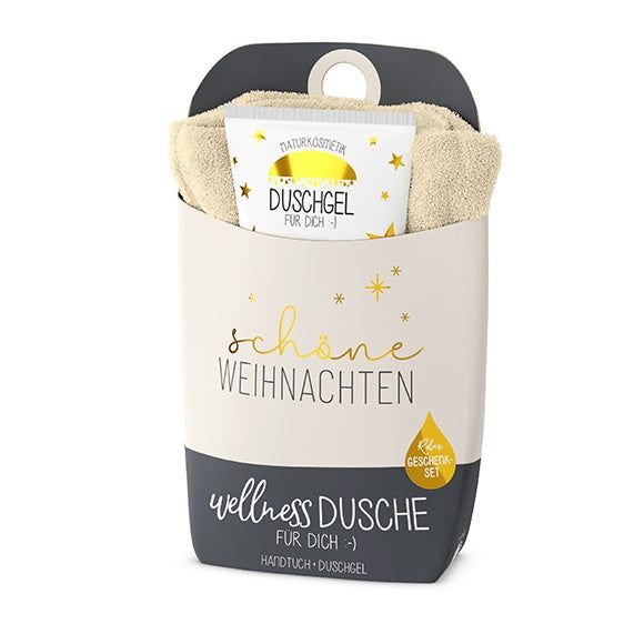 Coffret cadeau avec serviette et gel douche. Emballage avec l'inscription 'Joyeux Noël' et 'Wellness Dusche'.