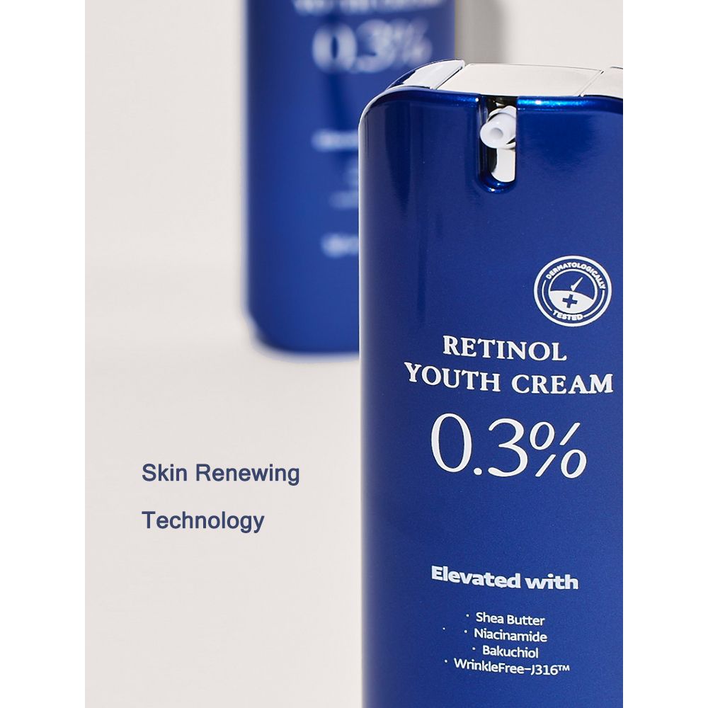 Flacon bleu avec texte : Skin Renewing Technology. Contient Retinol Youth Cream 0,3%. Avec beurre de karité, niacinamide, bakuchiol.