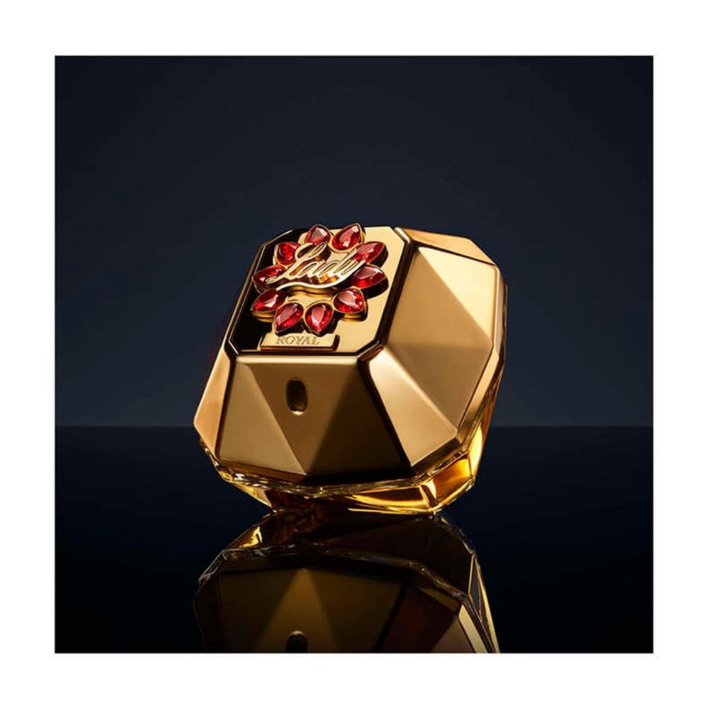 Flacon doré. Bouchon rouge avec inscription Lady Million Royal. Fond noir.