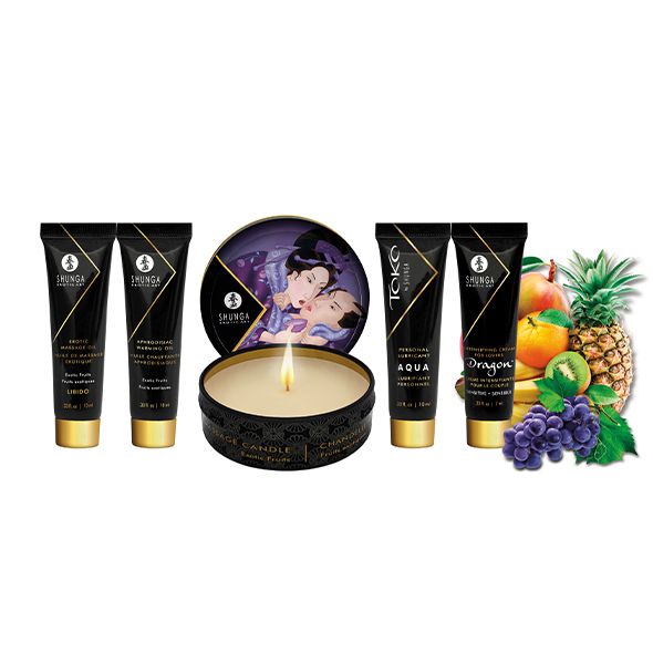Diverse tubes en een kaars. De tubes tonen "Shunga". Vruchten: mango, kiwi, druiven, ananas en sinaasappel.