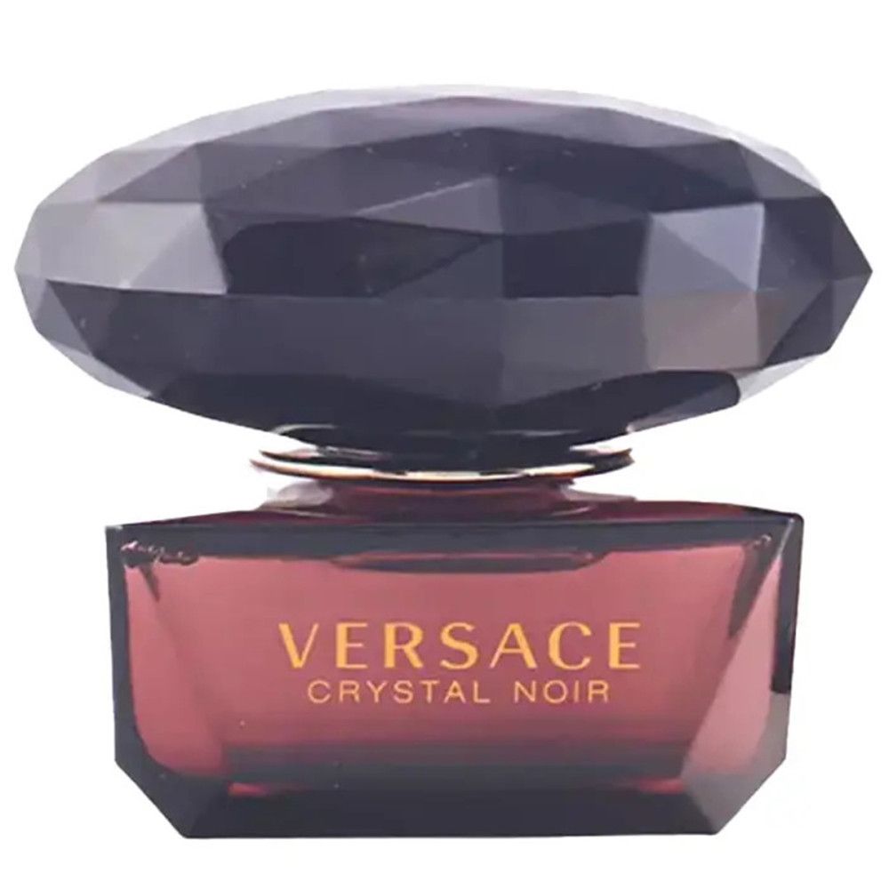 Versace Crystal Noir fles. Donkerbruine, facetgeslepen dop. Opschrift Versace Crystal Noir.