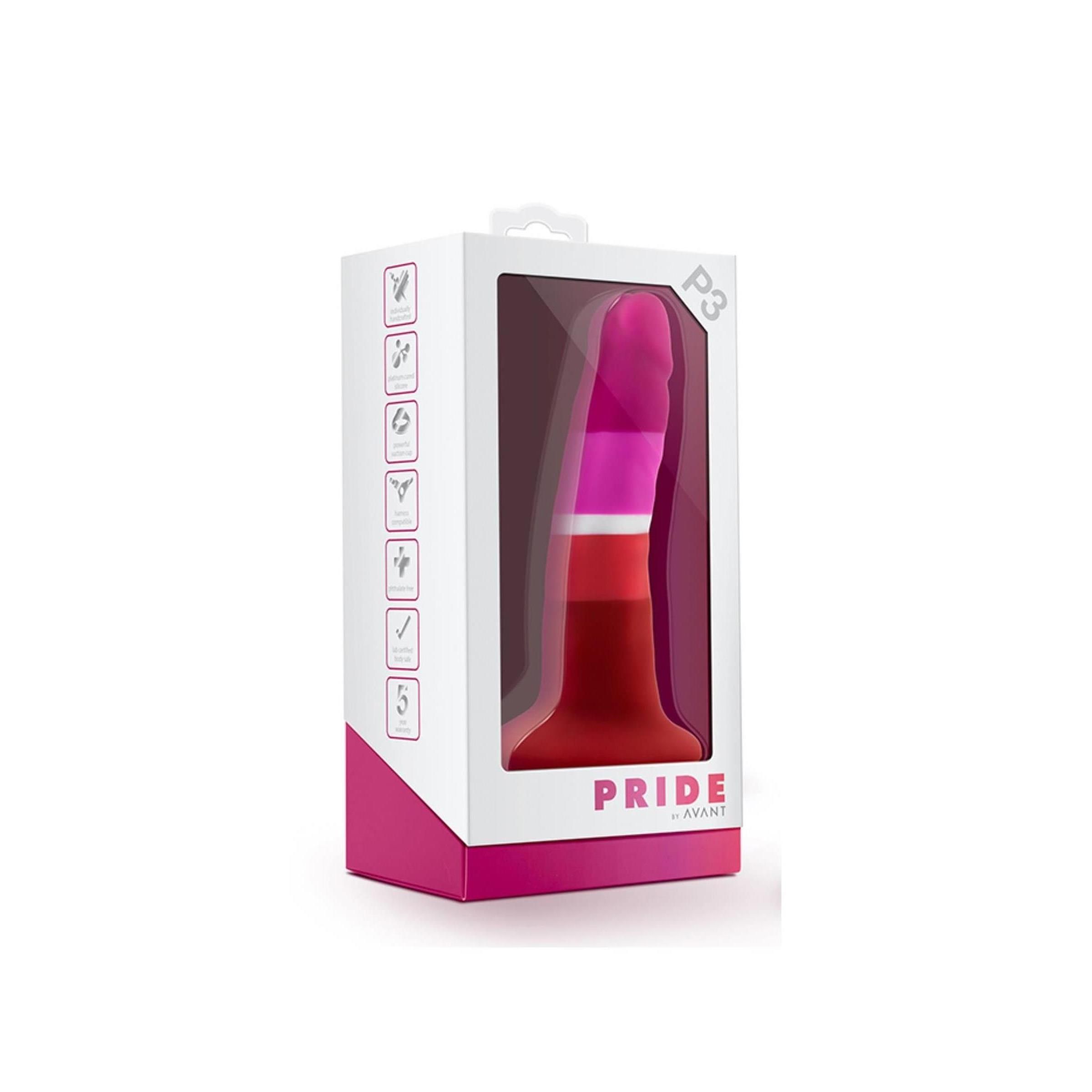 Dildo in verpakking. Kleuren: roze, wit, oranje en rood. Verpakking met venster. Tekst: "PRIDE AVANT".