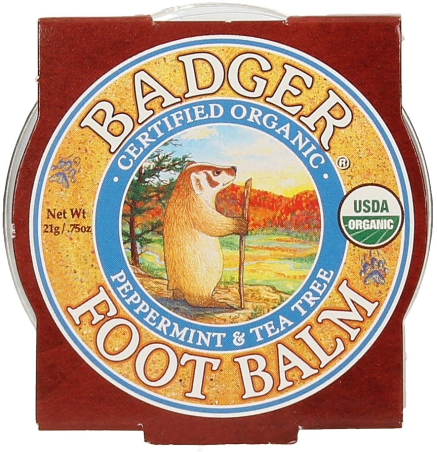 Ronde pot met bruin deksel. Label met "BADGER FOOT BALM". Illustratie van een das. USDA Organic keurmerk.