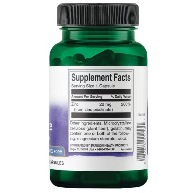 Achterkant van groene fles. Etiket met voedingswaarde: Zink 22 mg. Overige ingrediënten: gelatine, magnesiumstearaat, silica.