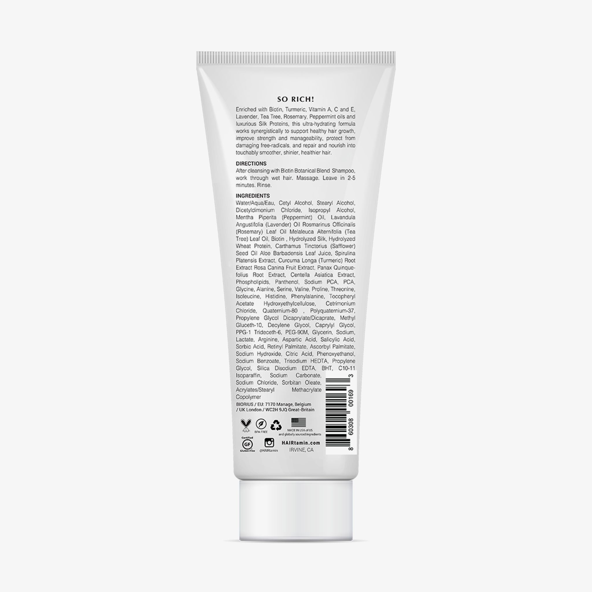 Dos d'un tube blanc. Texte avec ingrédients, instructions d'utilisation et informations fabricant. Logo végétalien.
