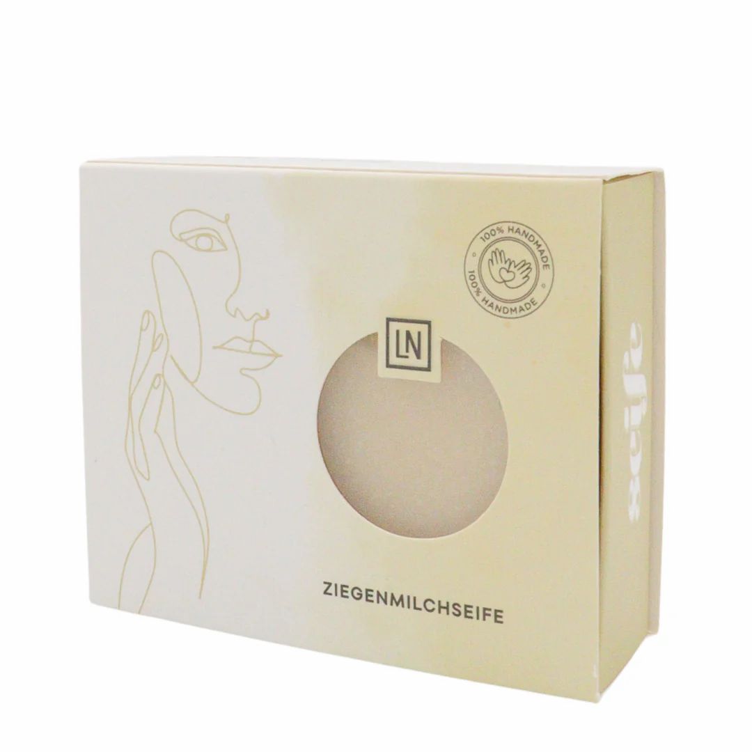Boîte avec savon. Fenêtre, inscription "ZIEGENMILCHSEIFE". Logo "LN" et "100% HANDMADE".