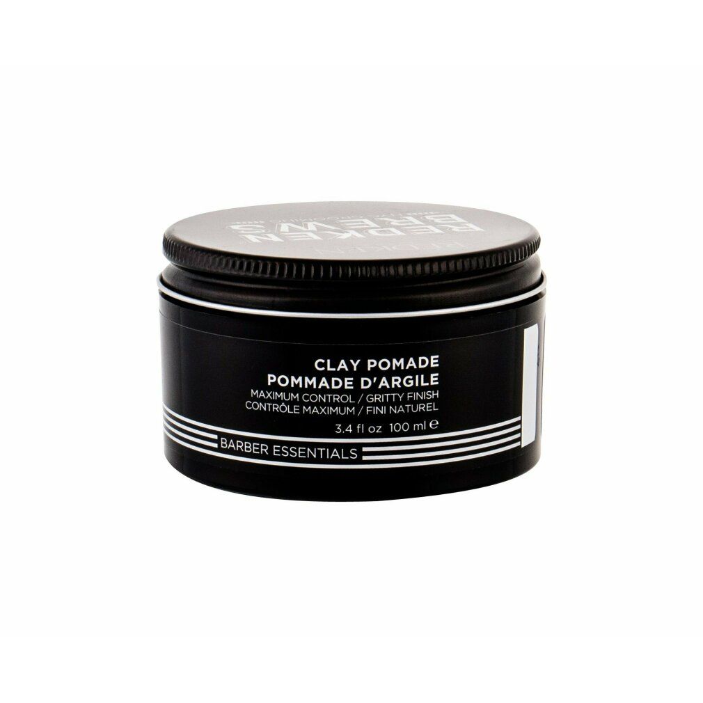 Pot noir avec couvercle. Inscription: Clay Pomade, Pommade d'Argile, Barber Essentials. 3.4 fl oz 100 ml.