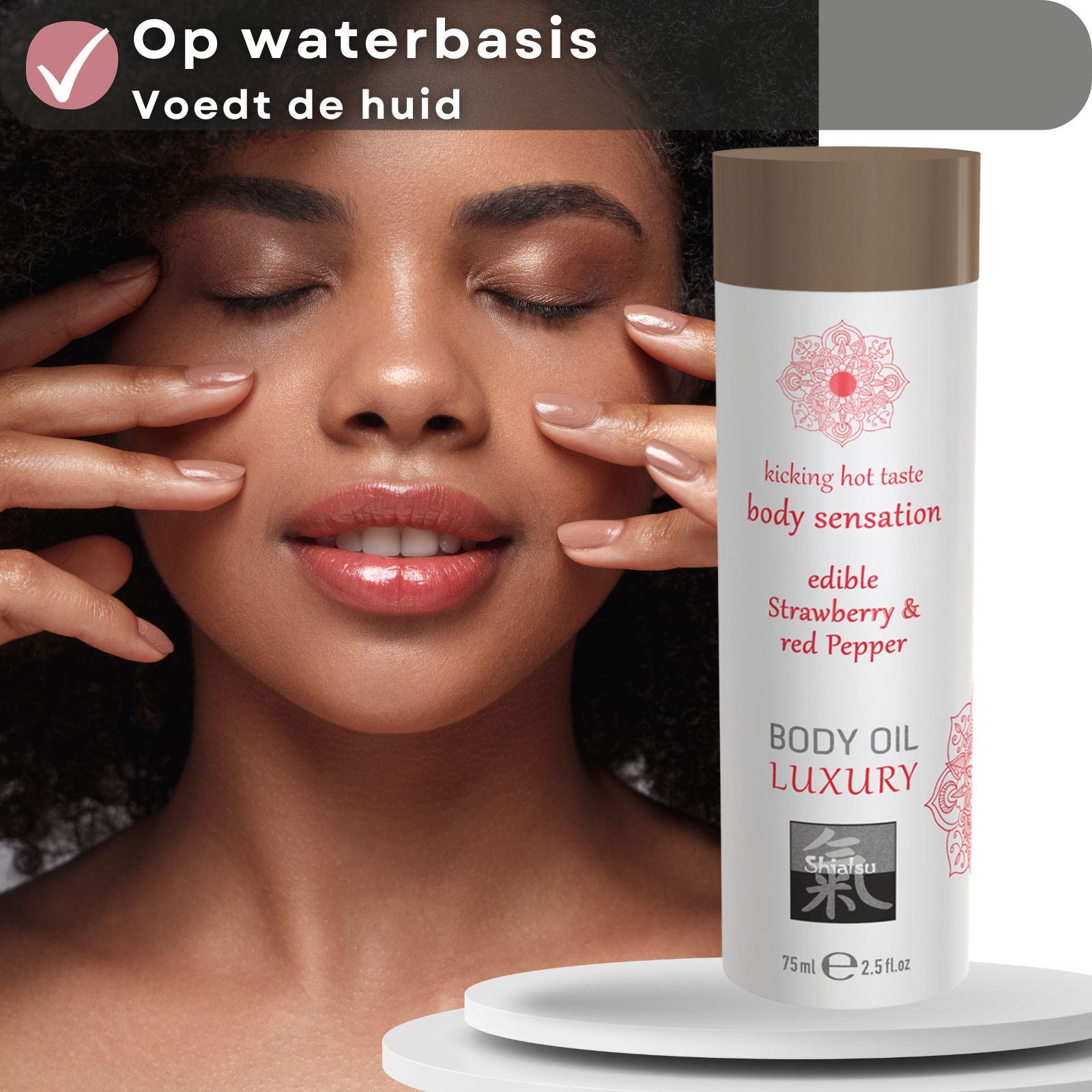 Fles Shiatsu Body Oil Luxury met aardbei- en rode peper smaak.