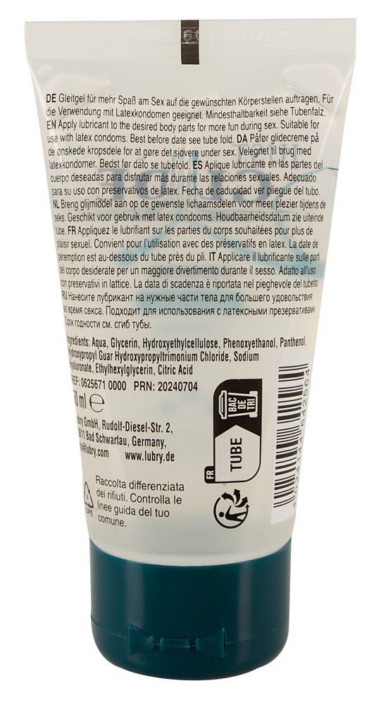 Dos d'un tube transparent avec bouchon bleu. Texte multilingue. Contient des ingrédients et des informations sur le fabricant.