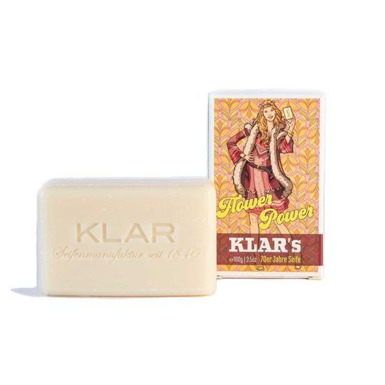 Klar's zeep en verpakking. Zeep rechthoekig, licht. Verpakking: Flower Power, vrouw met zeep. Opdruk: Klar's, zeep uit de jaren 70.