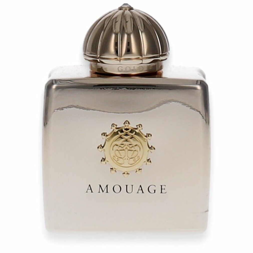 Flacon doré avec bouchon doré. Inscription AMOUAGE. Emblème du logo sur le devant.