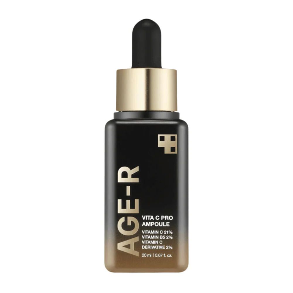 Age-R Vita C Pro Ampoule. Flacon noir avec bouchon doré. Texte : Age-R, Vita C Pro, Vitamine C 21%, Vitamine B5 2%, Vitamine C Derivative 2%.