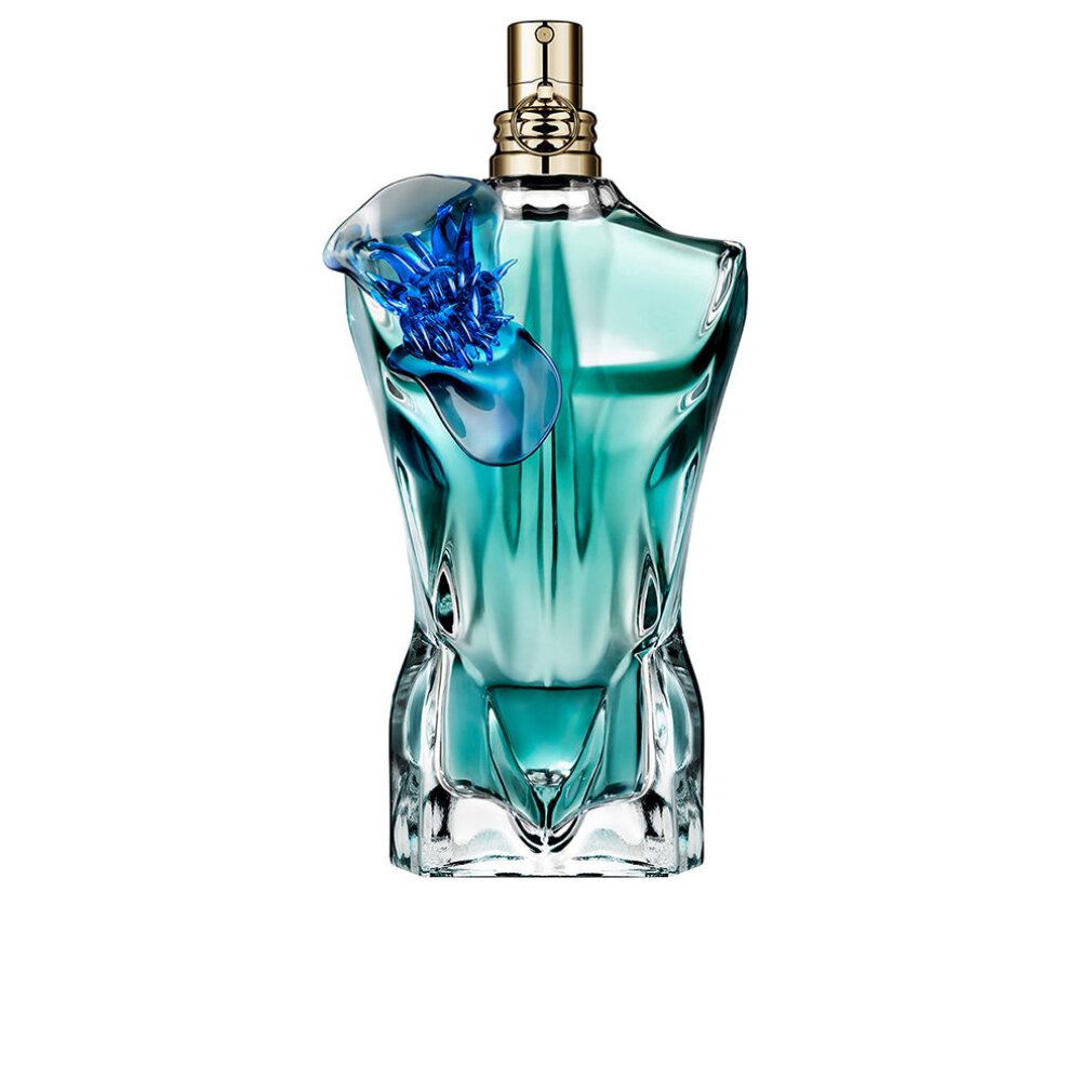 Flacon turquoise en forme de torse avec ornement floral bleu. Tête de pulvérisation dorée.
