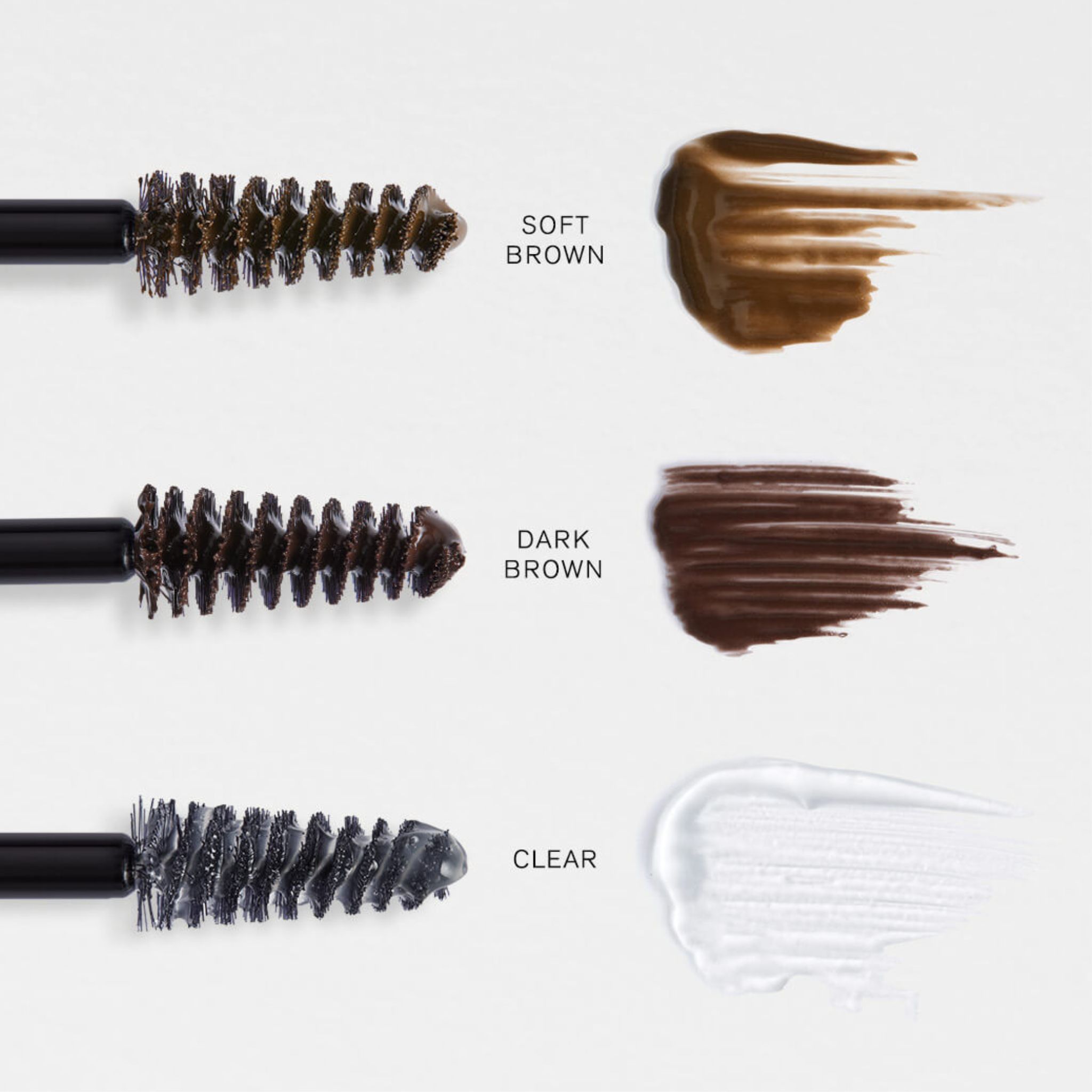 Applicateurs brosse et échantillons de couleur pour gel brun clair, brun foncé et clair.