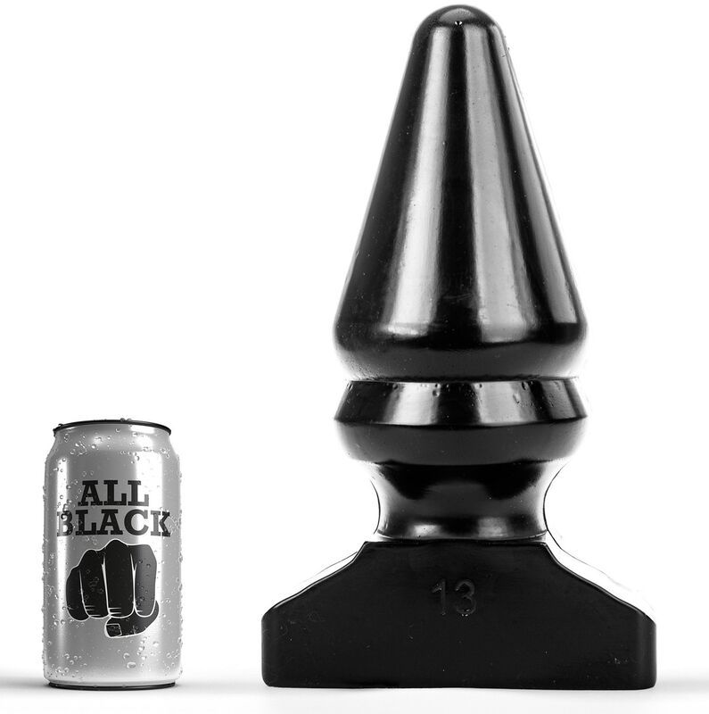 Bouchon anal noir à côté d'une canette marquée 'All Black'.