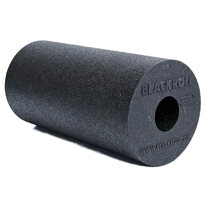 Rouleau de fascia noir. Forme cylindrique, logo du fabricant sur la face. Fabriqué en Allemagne.