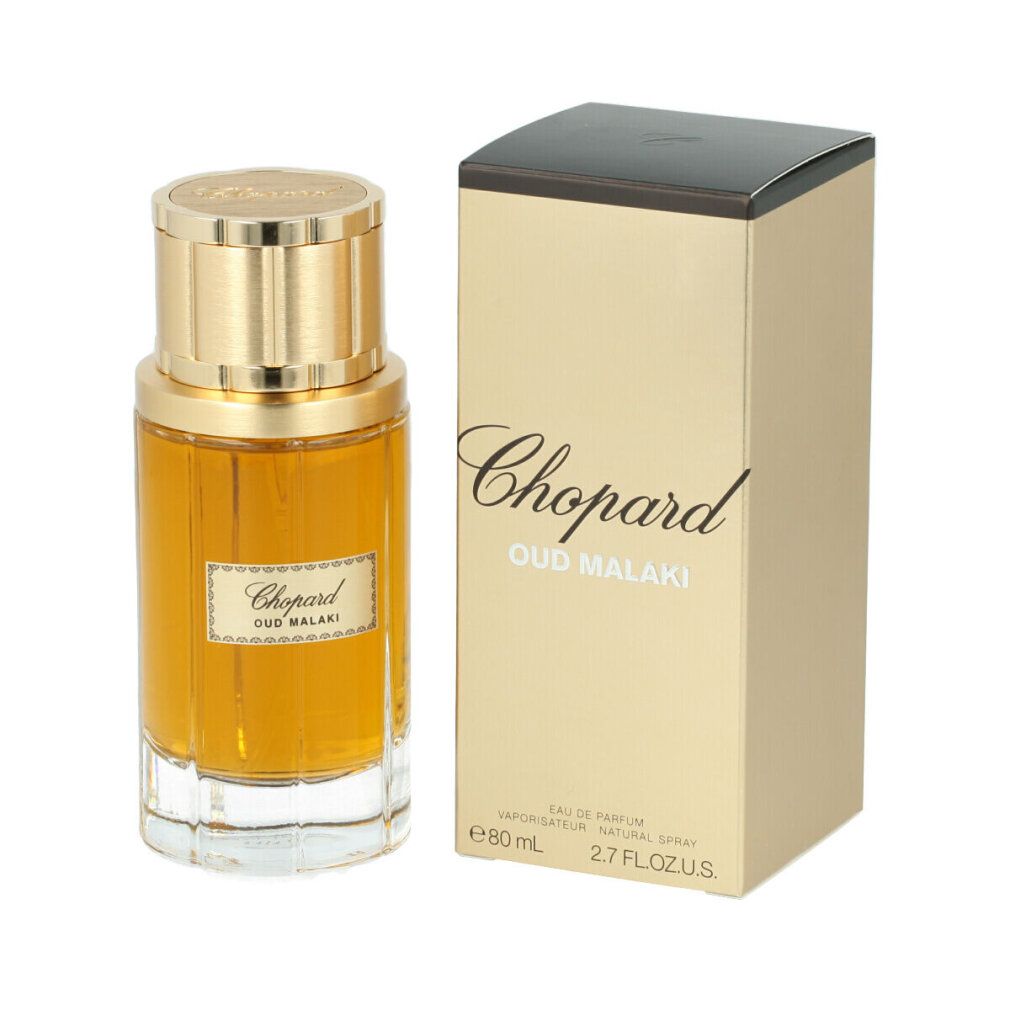 Flacon de parfum et emballage. Flacon doré avec bouchon doré. Inscription : Chopard Oud Malaki. Emballage avec texte.