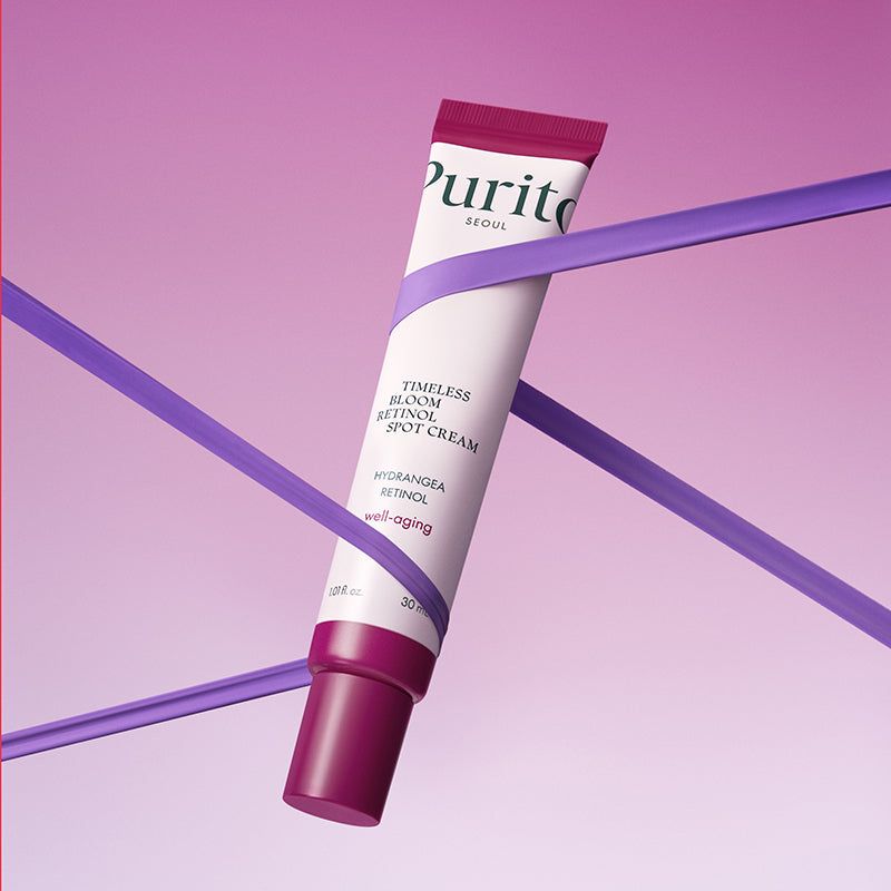 Tube de crème PURITO. Tube blanc avec bouchon violet. Rubans violets en arrière-plan.