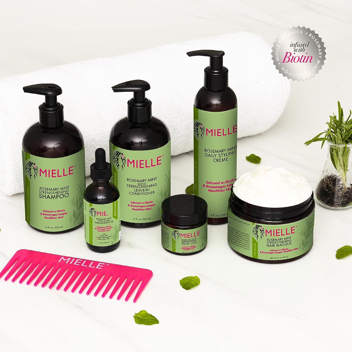 Mielle Rosemary Mint productlijn: shampoo, conditioner, crème, olie en haarmasker met kam.