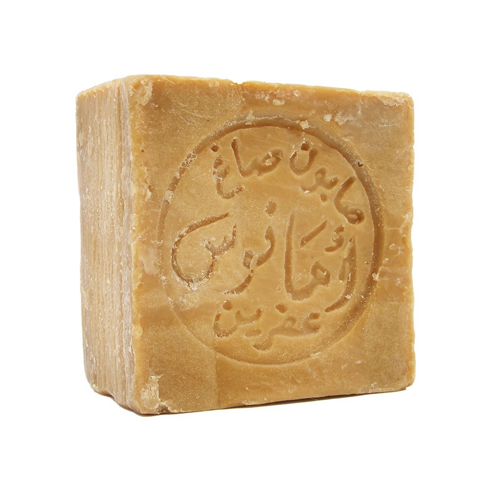 Un savon carré, inscription arabe circulaire. Couleur brun clair.