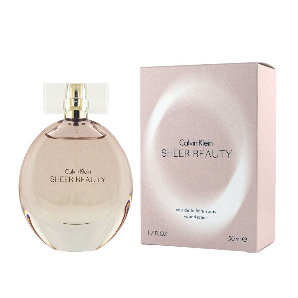 Flacon et emballage parfum. Inscription: Calvin Klein Sheer Beauty. Flacon rond, liquide rose.