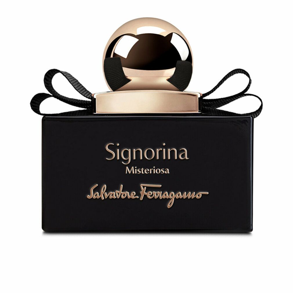 Zwarte fles met gouden dop en strik. Opschrift Signorina Misteriosa en Salvatore Ferragamo.