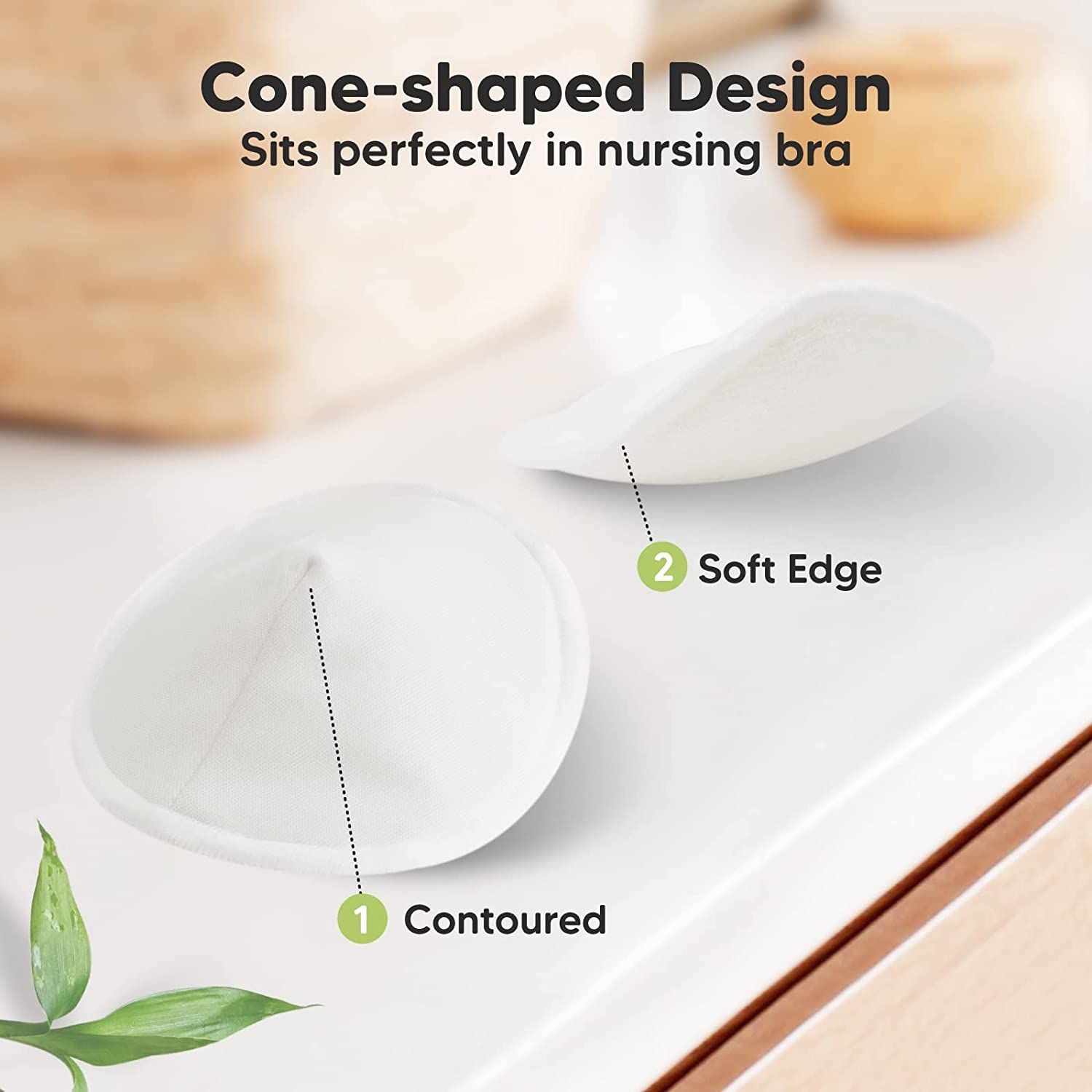 Twee kegelvormige zoogcompressen. Opschrift: Cone-shaped Design, Soft Edge, Contoured.