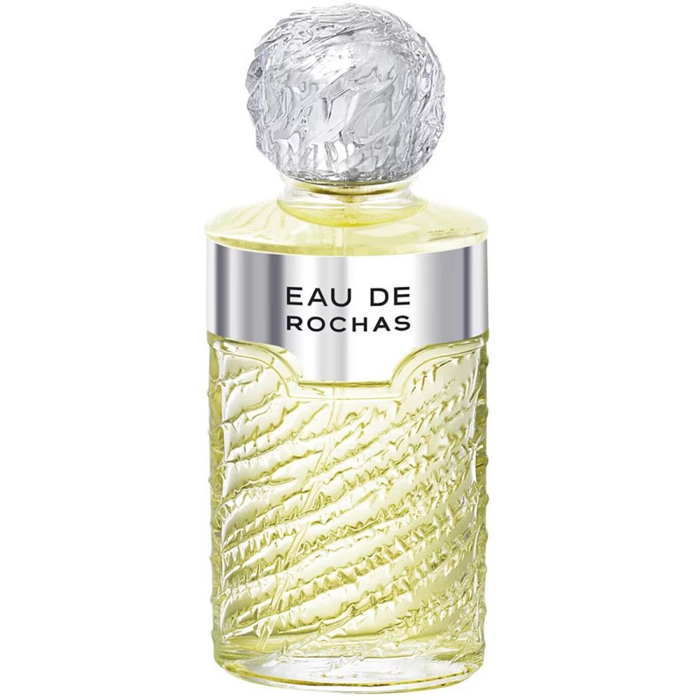 Flacon Eau de Rochas. Flacon avec col et bouchon argentés. Structure en verre cannelé.