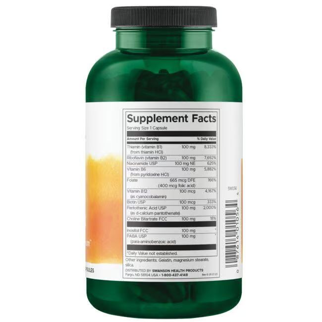 Dos d'un flacon vert. Étiquette blanche avec informations nutritionnelles. Contient un complexe de vitamine B. Liste des ingrédients et informations fabricant.