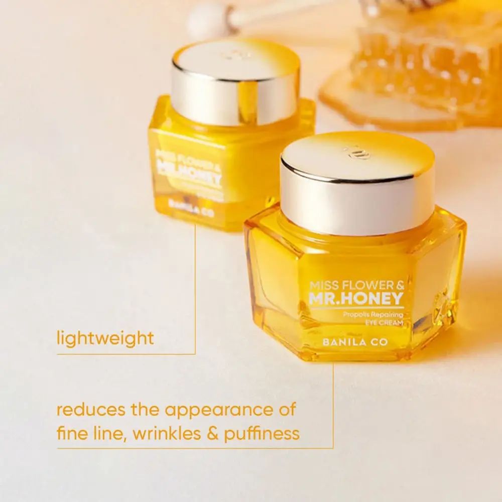 Twee gouden oogcrème potjes. Opschrift: Miss Flower & Mr. Honey. Tekst: Vermindert fijne lijntjes, rimpels en wallen.
