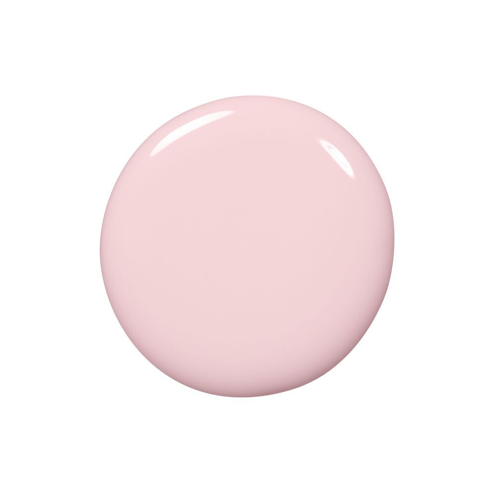 Goutte de vernis à ongles rose sur fond blanc.