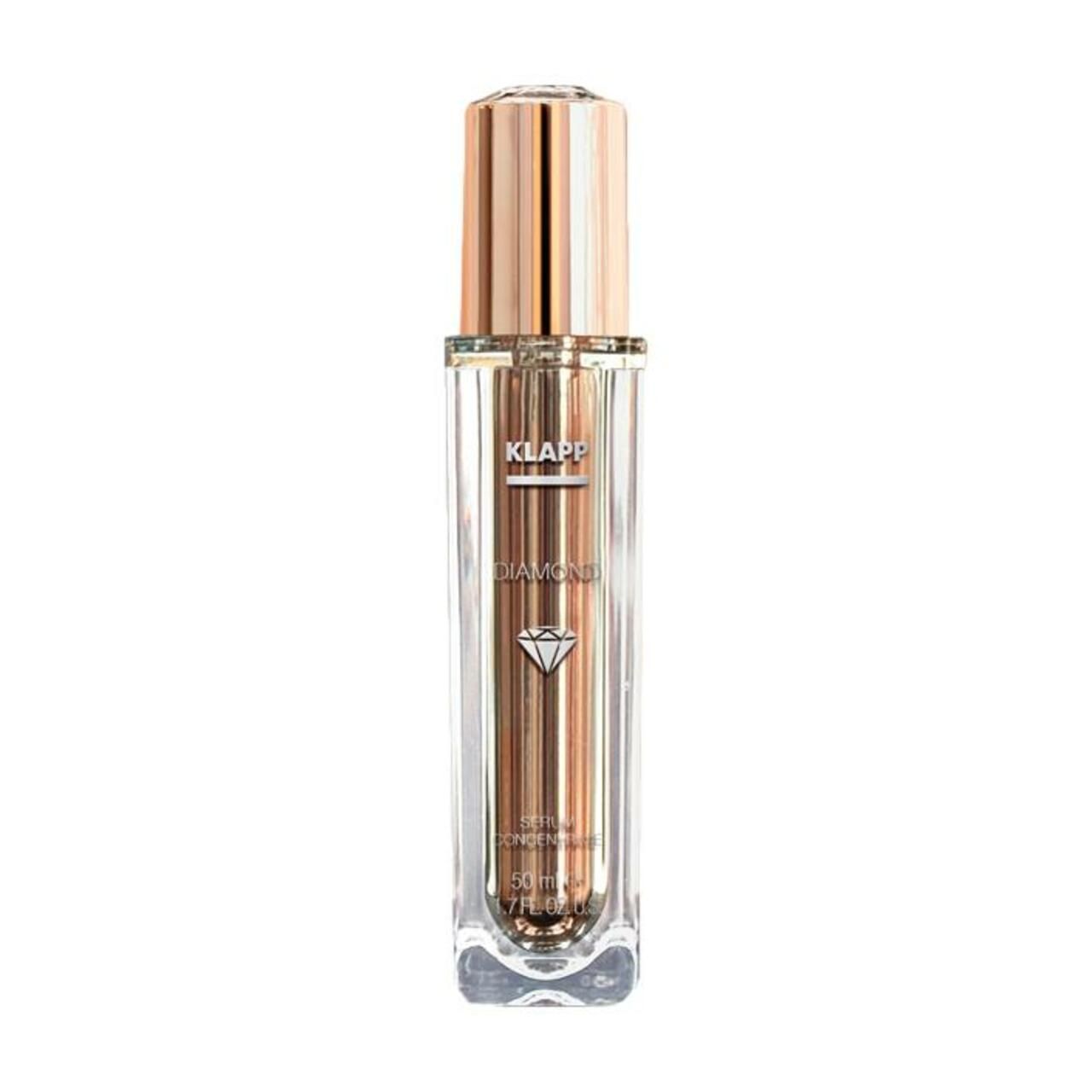 Transparante fles met gouden dop. Opschrift: Klapp, Diamond, Serum. Diamant symbool.