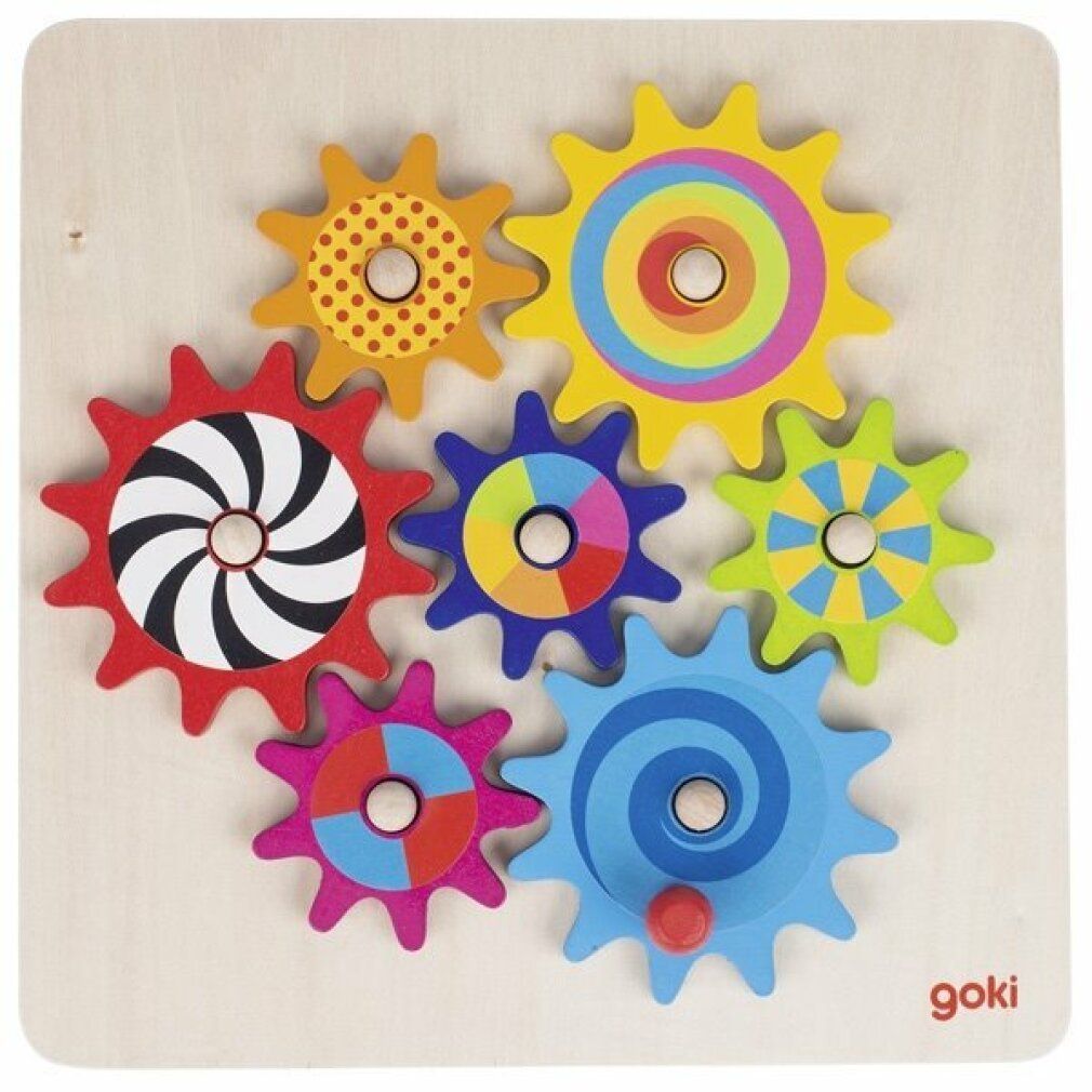 Puzzle en bois avec 7 engrenages colorés. Chaque roue a un motif différent. Logo Goki en bas à droite.
