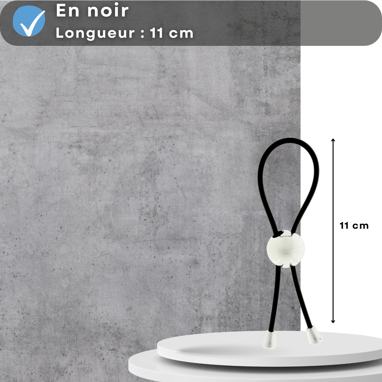 Anneau pénien, noir, 11 cm. Sur socle, fond gris.