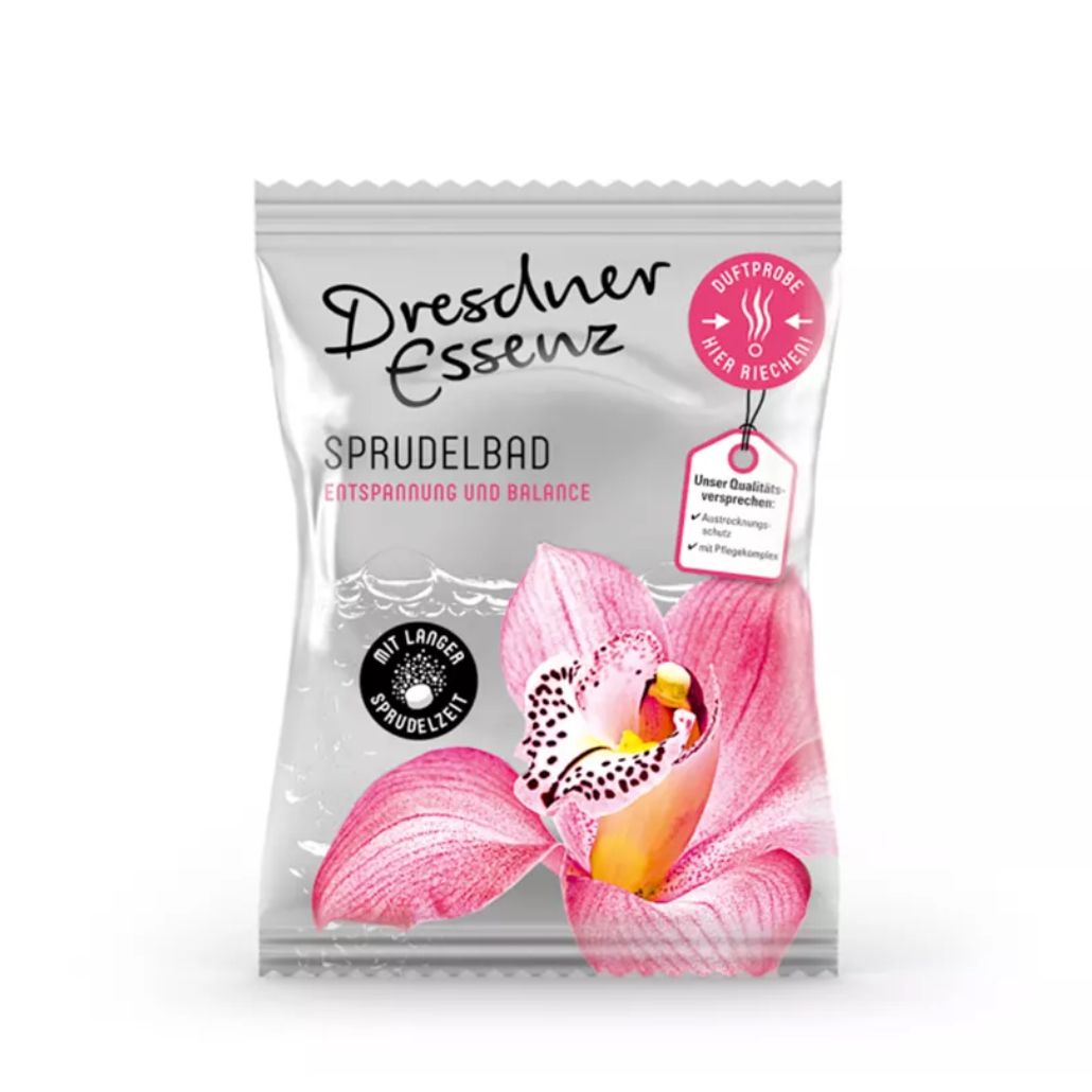 Zakje met productopdruk. Tekst: Dresdner Essenz, Sprudelbad Entspannung & Balance. Afbeelding van een orchidee. Label met kwaliteitsbelofte.
