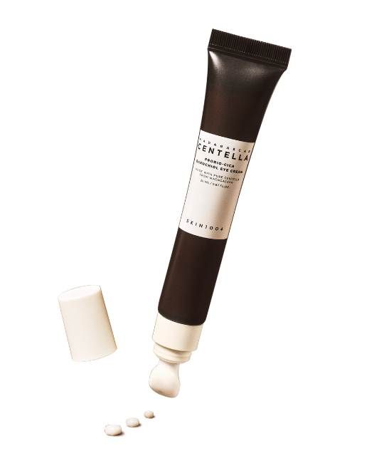 Crèmetube met witte punt en dop. Productnaam en merk zichtbaar.