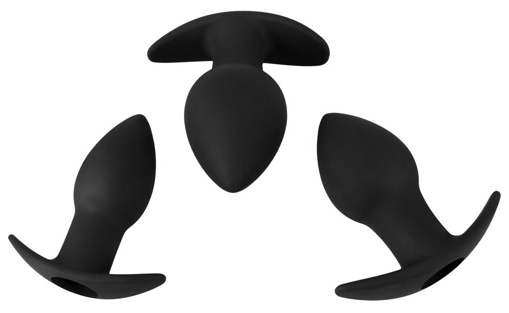 Trois plugs anaux noirs en silicone disposés en triangle, vus de dessus.