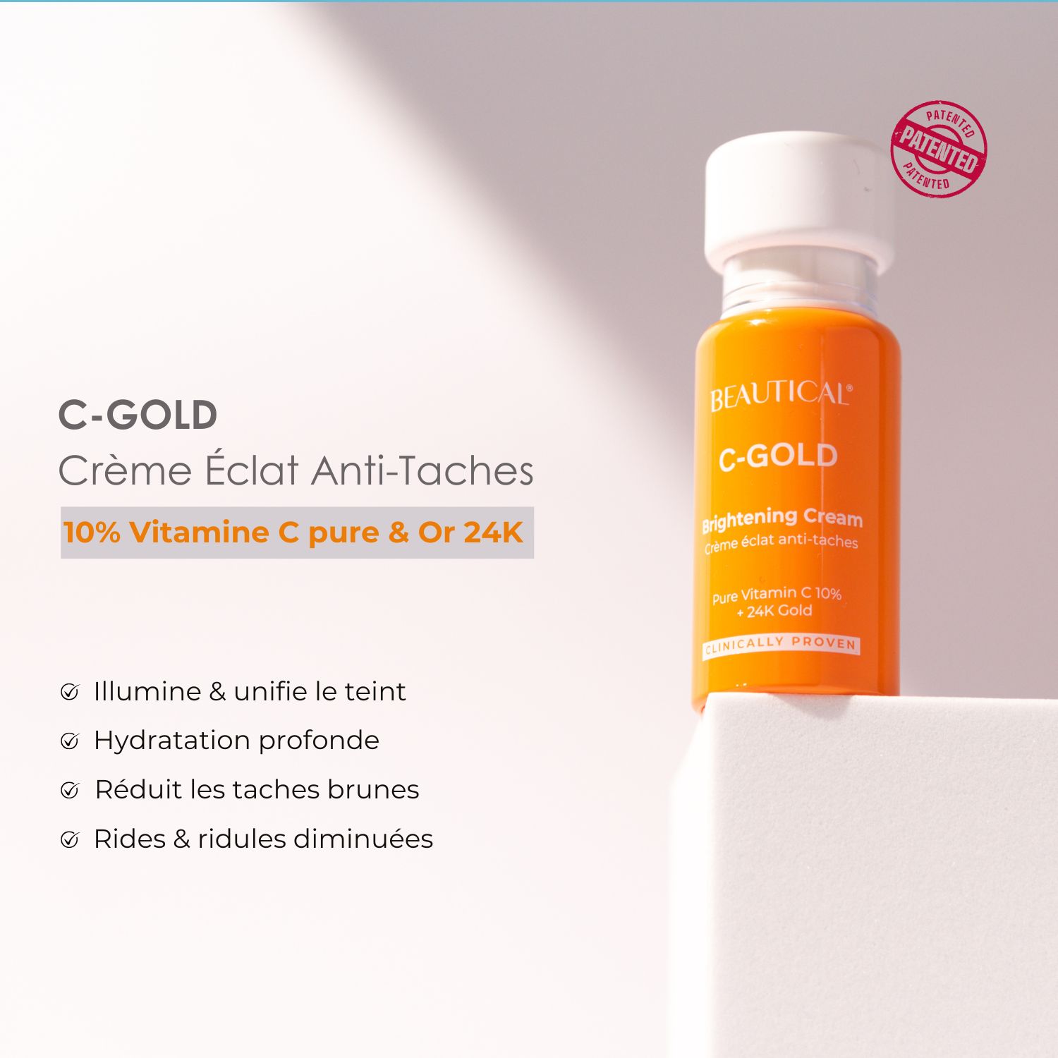 Productfles en tekst. Opschrift: C-GOLD Crème Éclat Anti-Taches. Tekst: 10% Vitamine C pure & Or 24K.